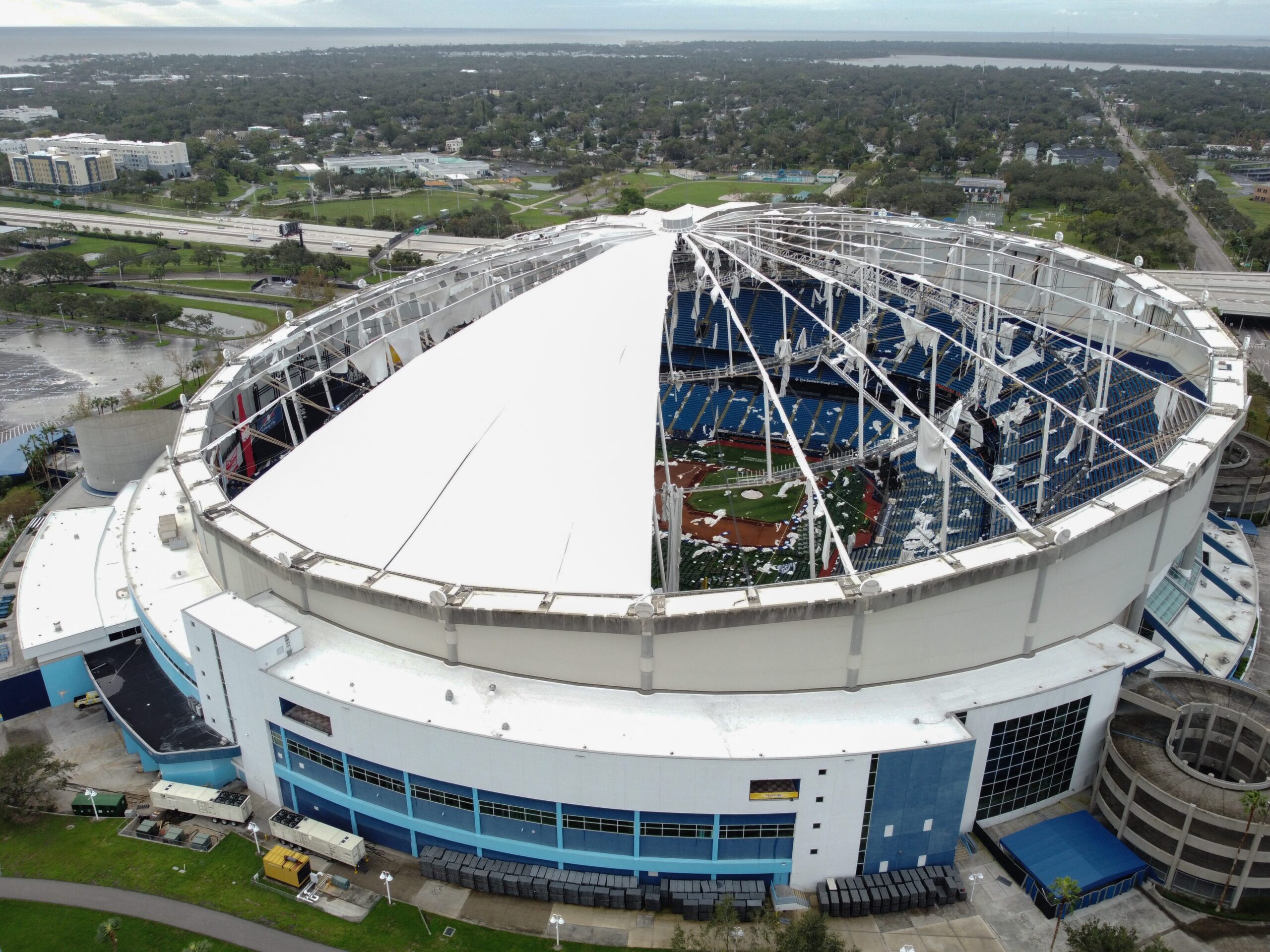 Hurricane Milton ripped through Tropicana Field, leaving the stadium's iconic retractable roof in tatters and the surrounding area flooded.